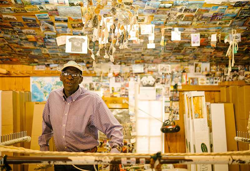 Artisan standing with his work at the Hammock Shops of Georgetown, SC.